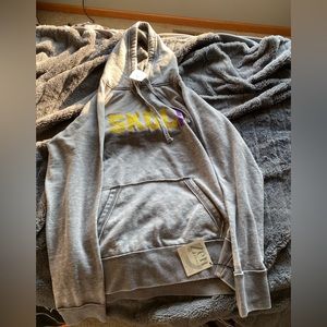 Size Large women’s Minnesota Vikings skol hoodie. Brand new with tags.